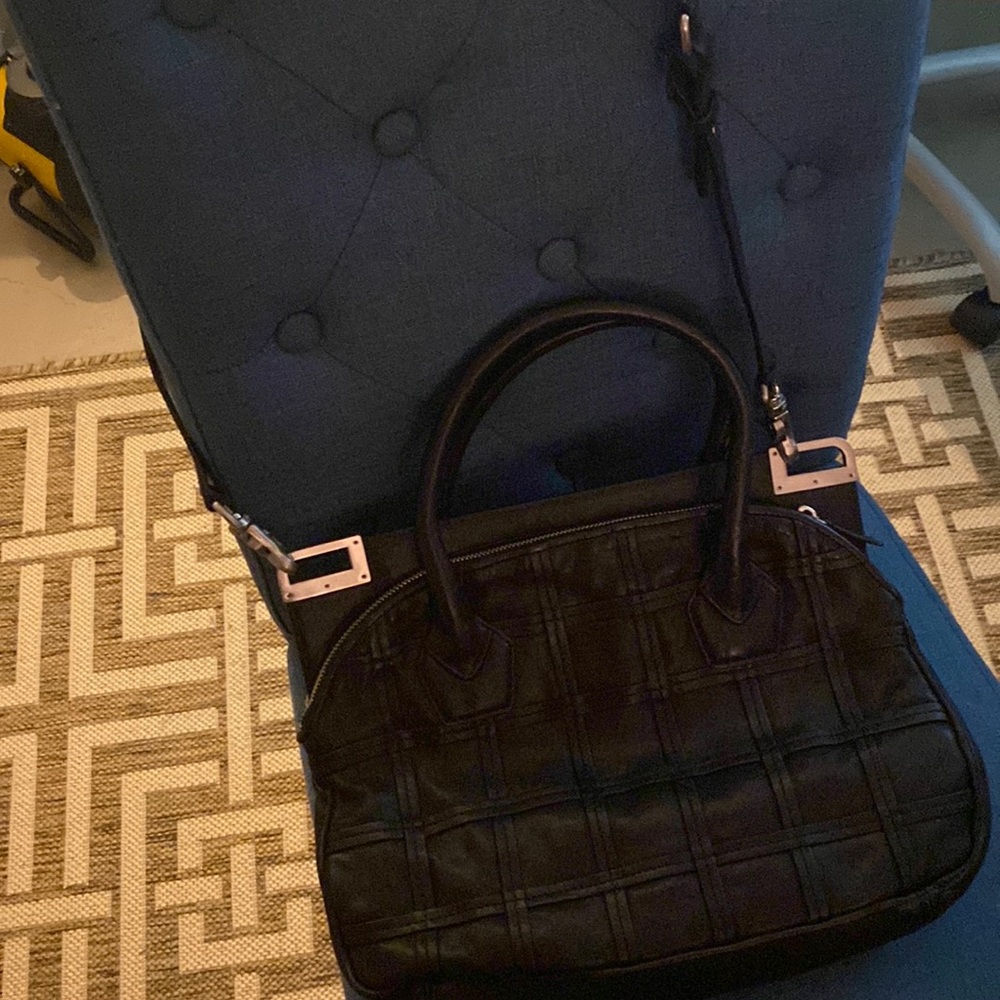 Botkier double handle leather bag with strap.